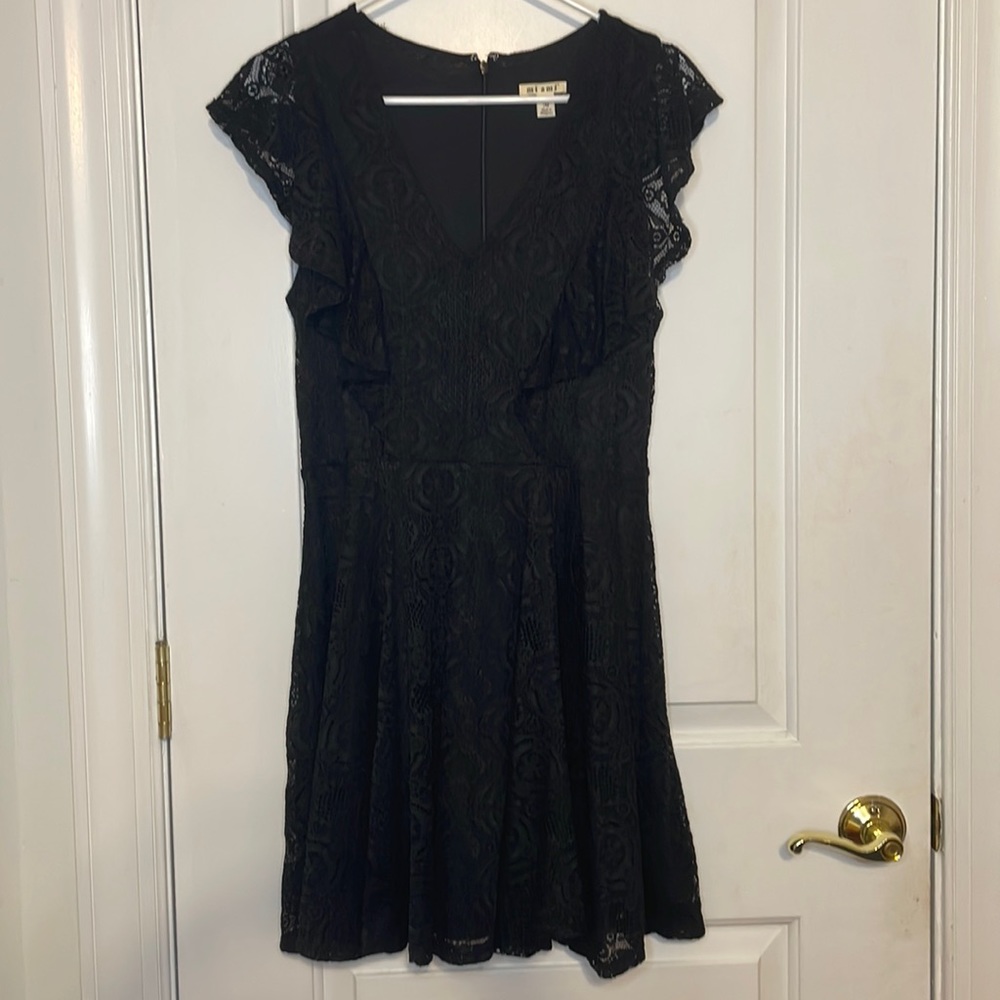 Black lace dress with ruffle detail on sleeves